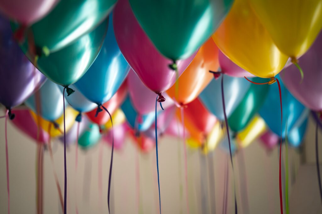 a group of balloons in a row