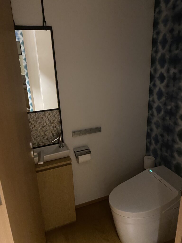 a toilet and sink in a bathroom