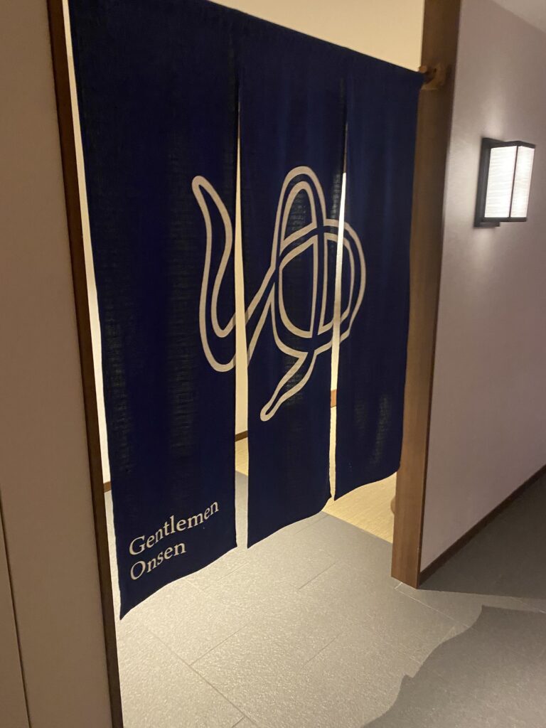 a blue curtain with white text on it