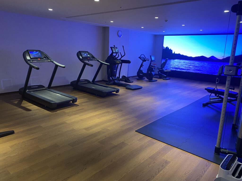 a room with treadmills and exercise equipment