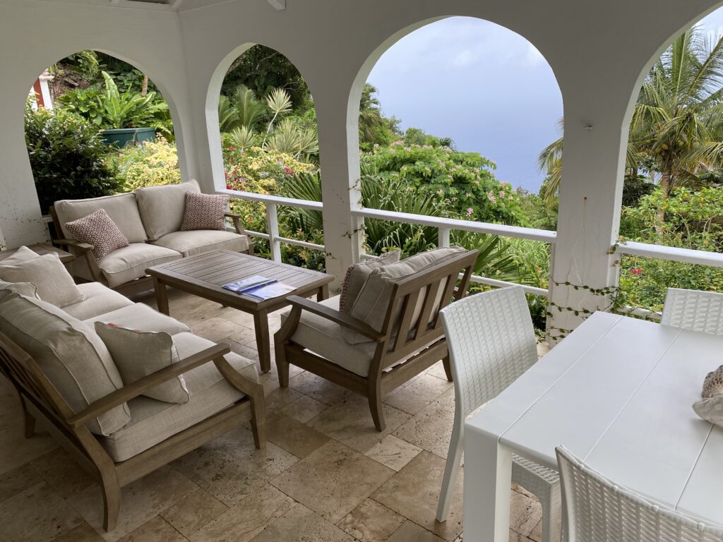 a patio with a table and chairs