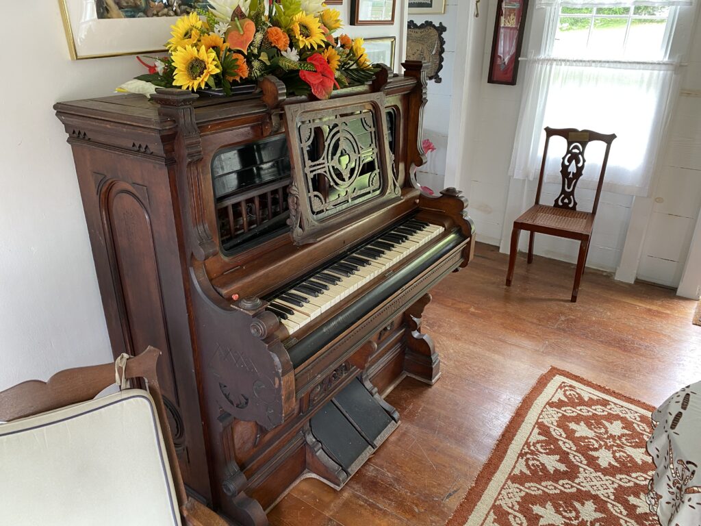 a piano with flowers on top of it