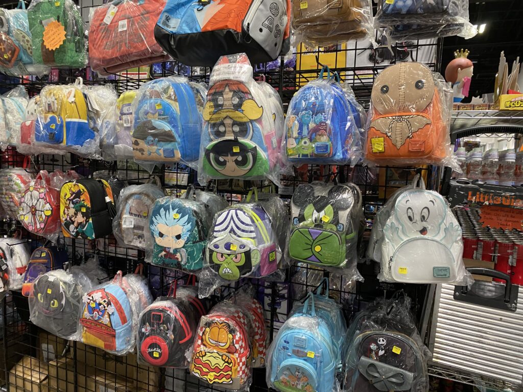 a group of backpacks in plastic wrap