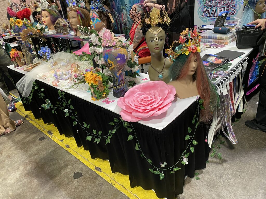 a table with mannequins and flowers