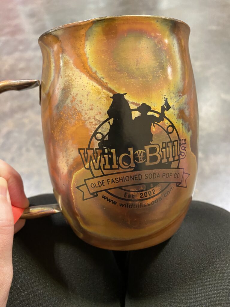 a hand holding a cup