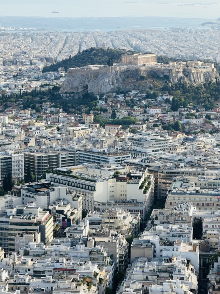a city with a hill in the background