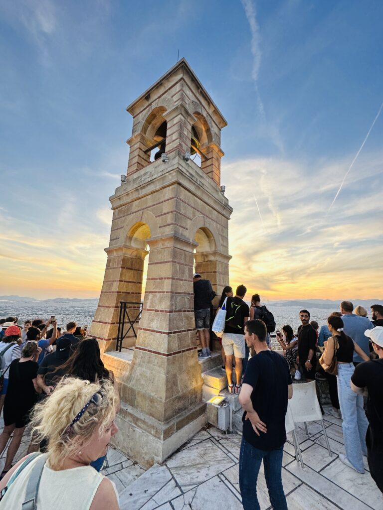 a group of people standing around a tower