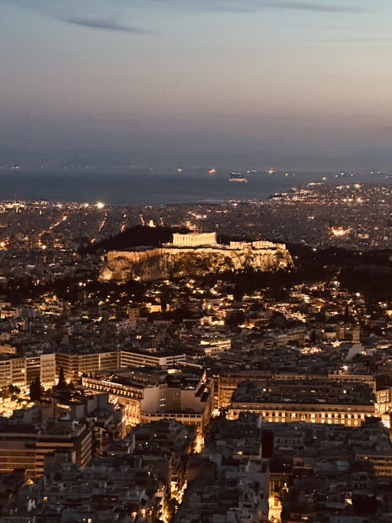 a city with a hill in the distance