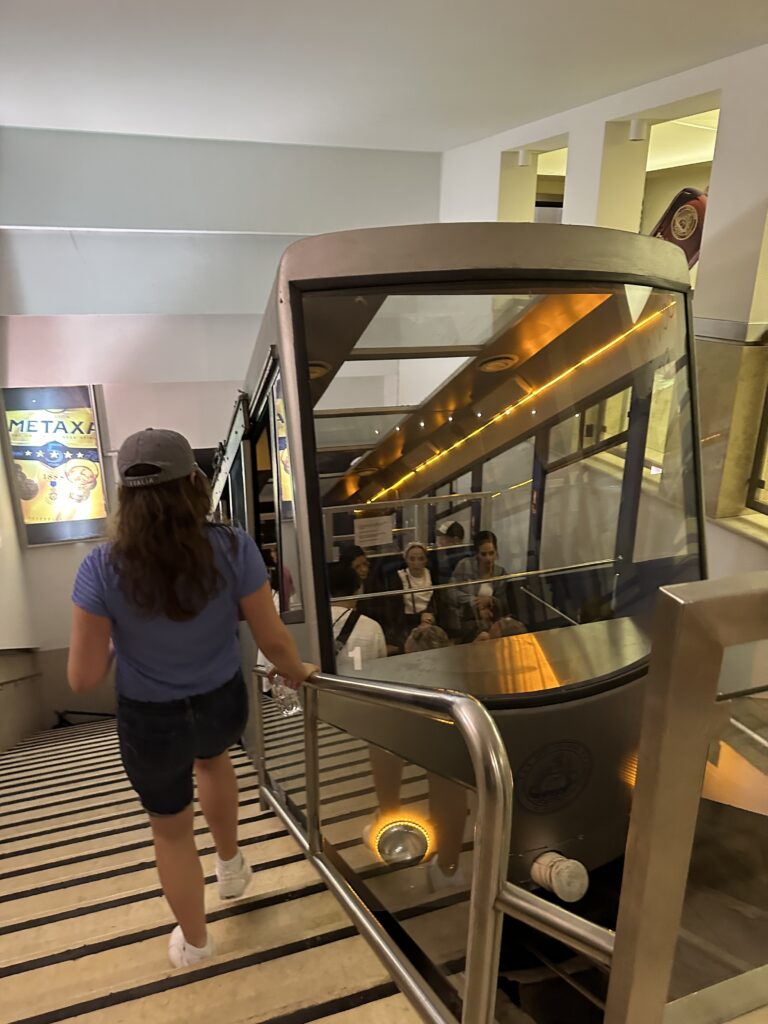 a woman walking up a staircase with a train