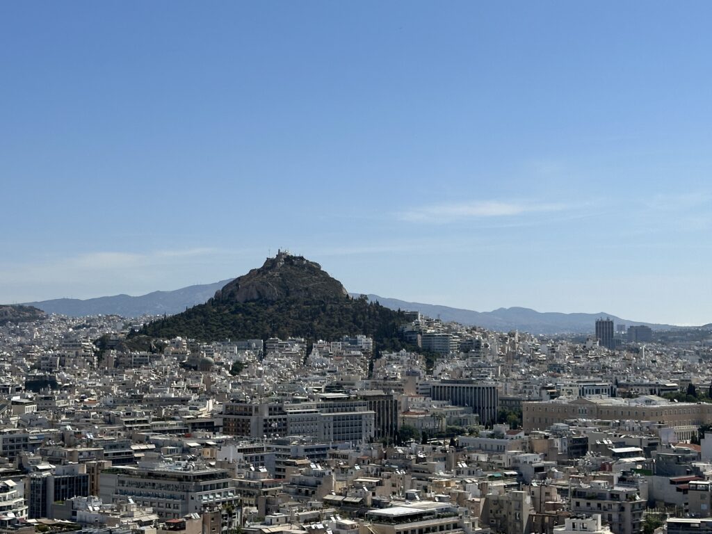 a city with a hill in the background