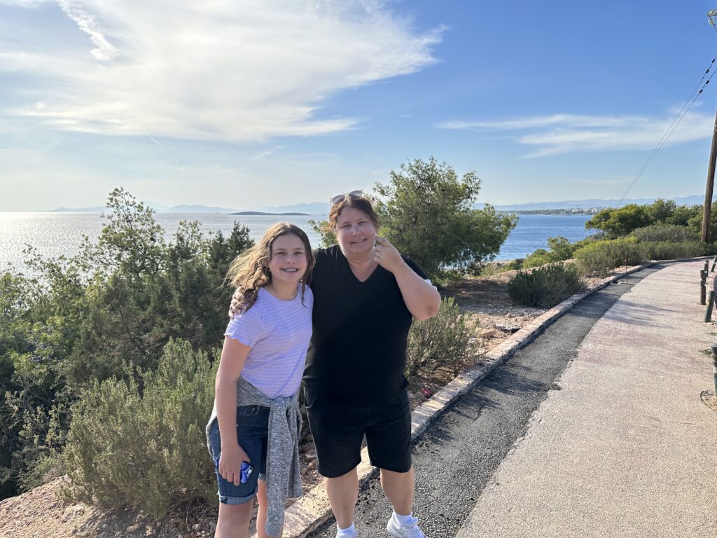 a woman and girl posing for a picture