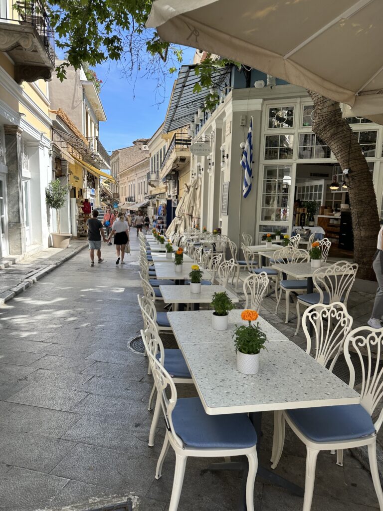 a street with tables and chairs