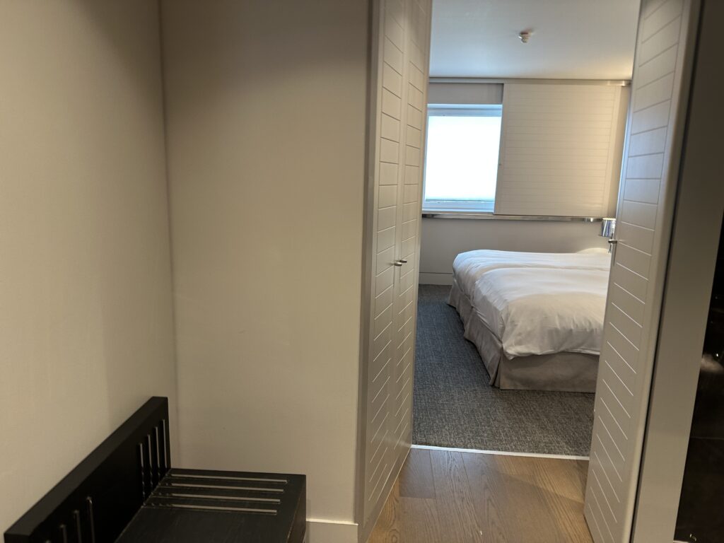 a bedroom with a bed and a chair