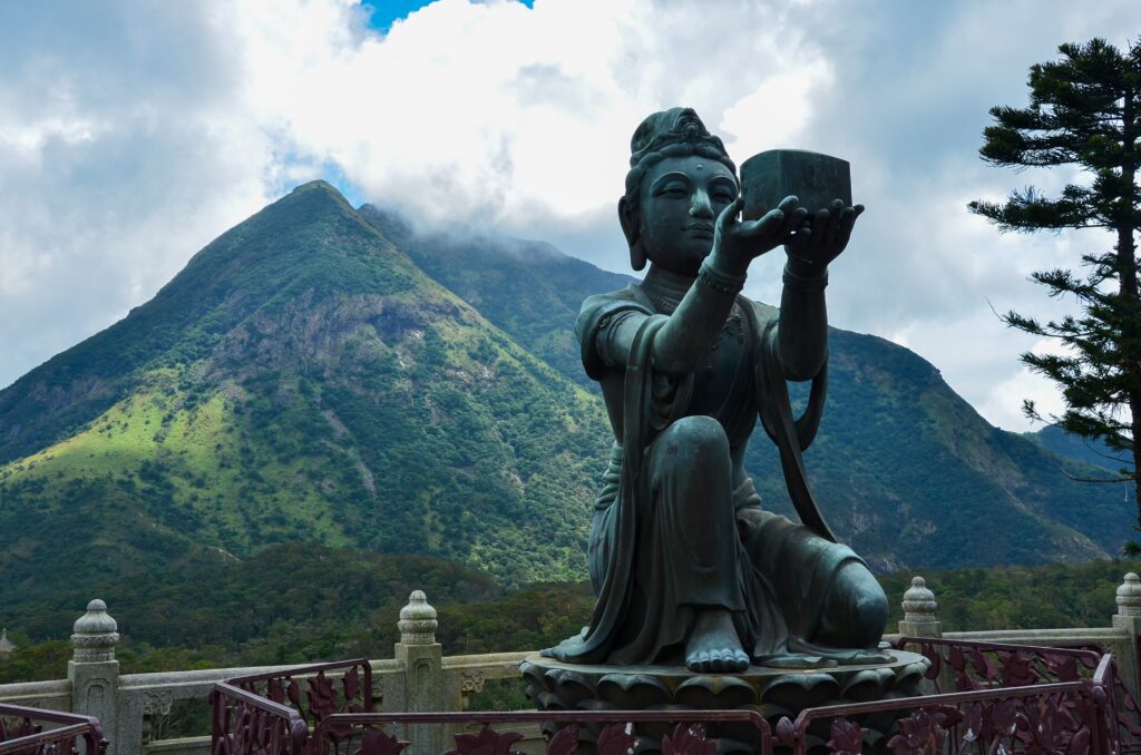 a statue of a woman holding a block