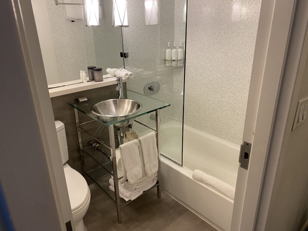 a bathroom with a glass shower door
