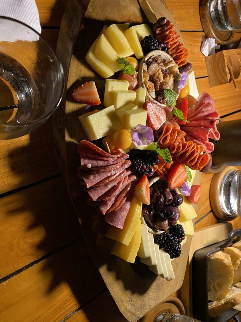 a platter of cheese and meat