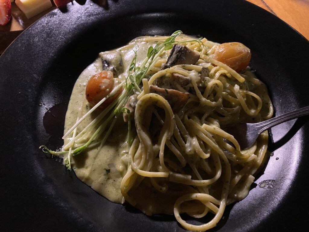 a plate of pasta with a fork