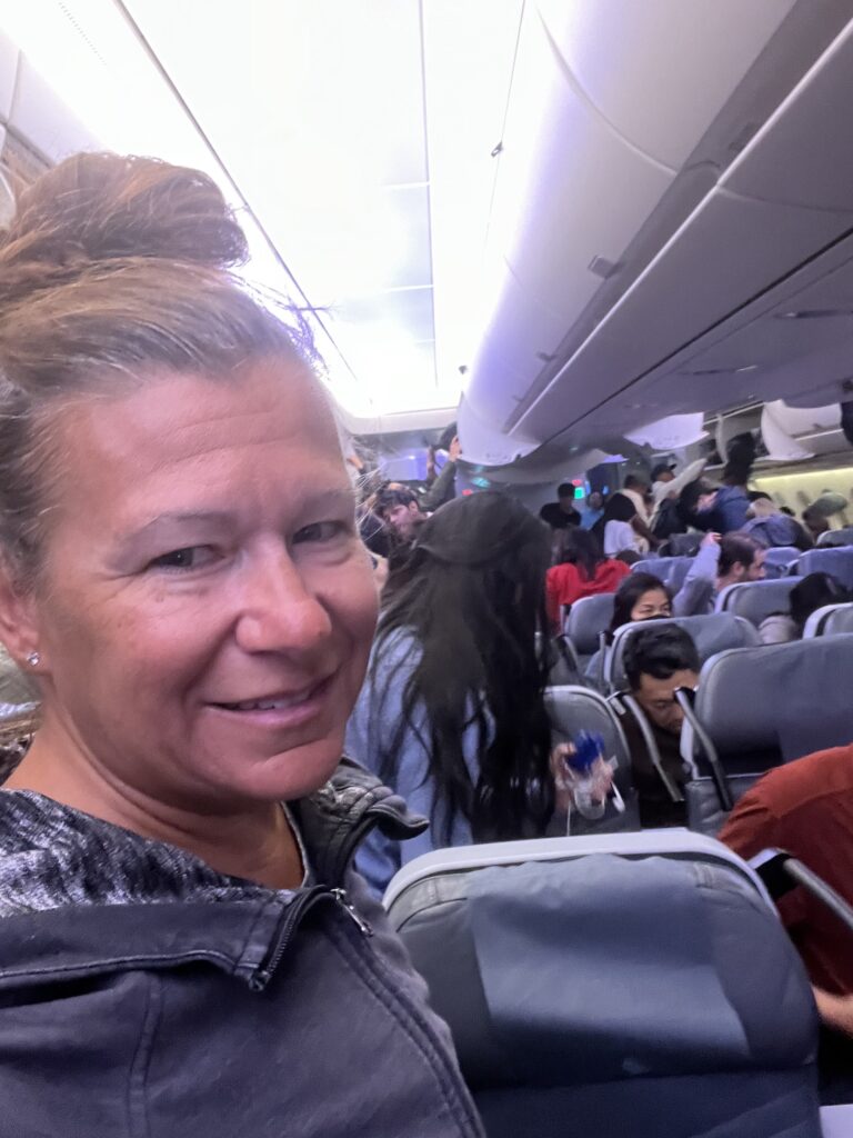 a woman taking a selfie in an airplane