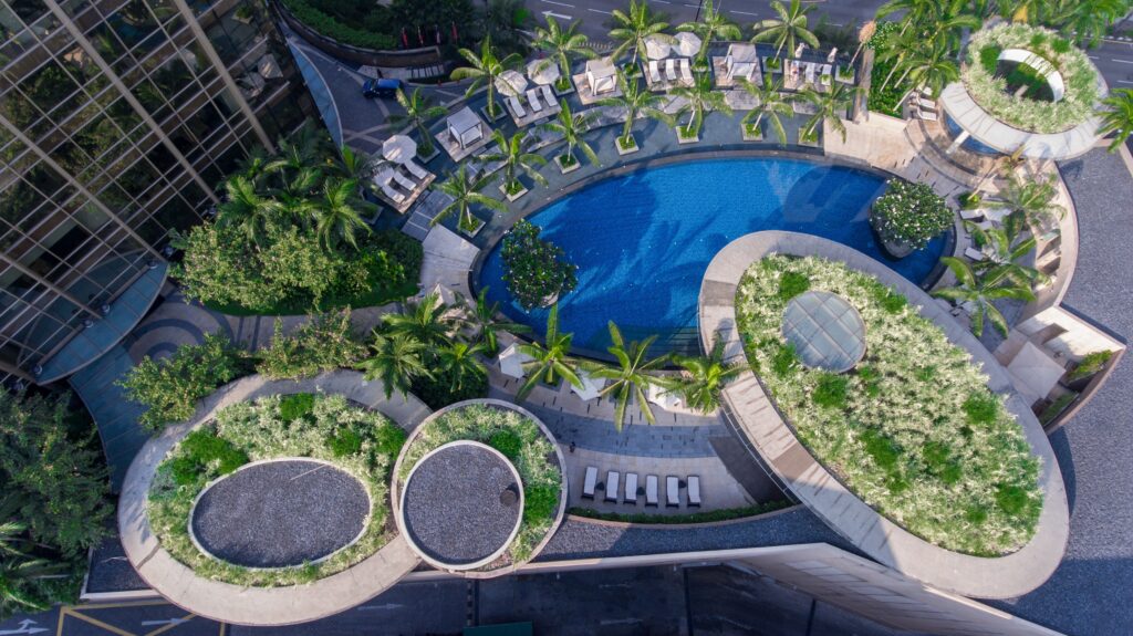 a pool with plants around it