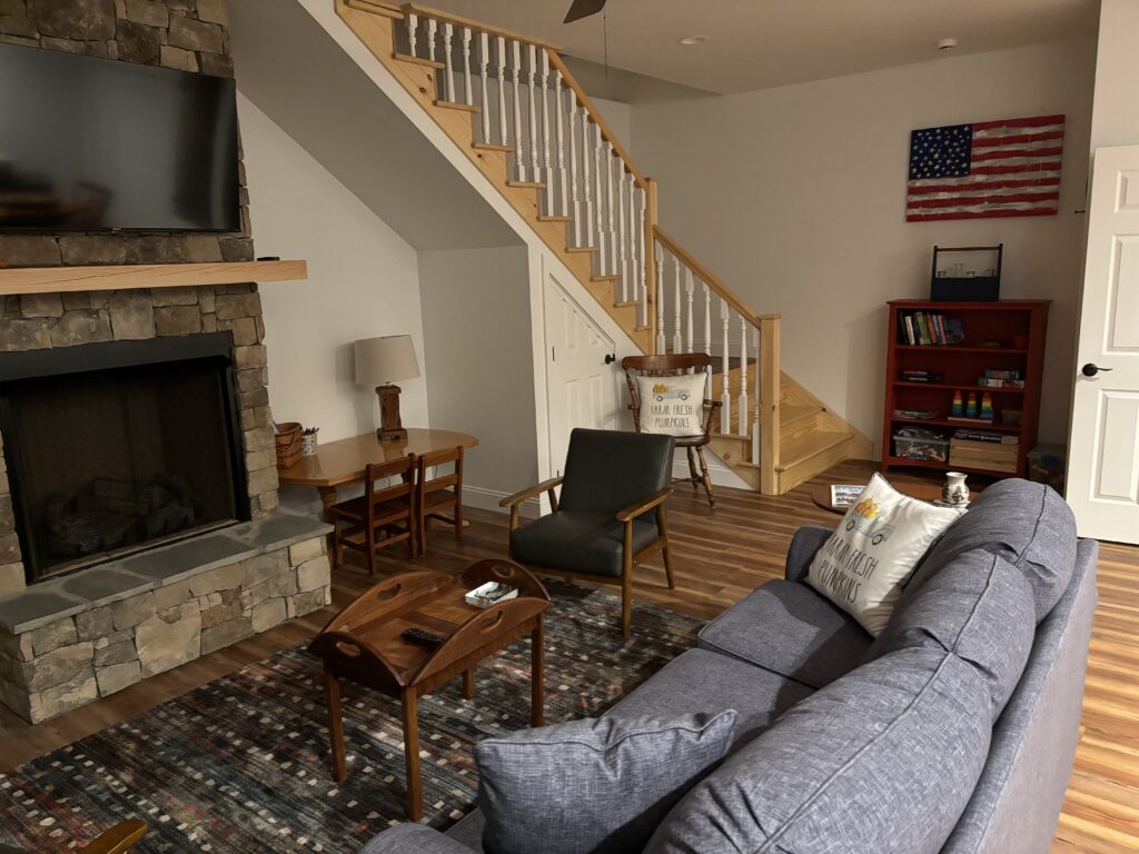 a living room with a fireplace and a couch