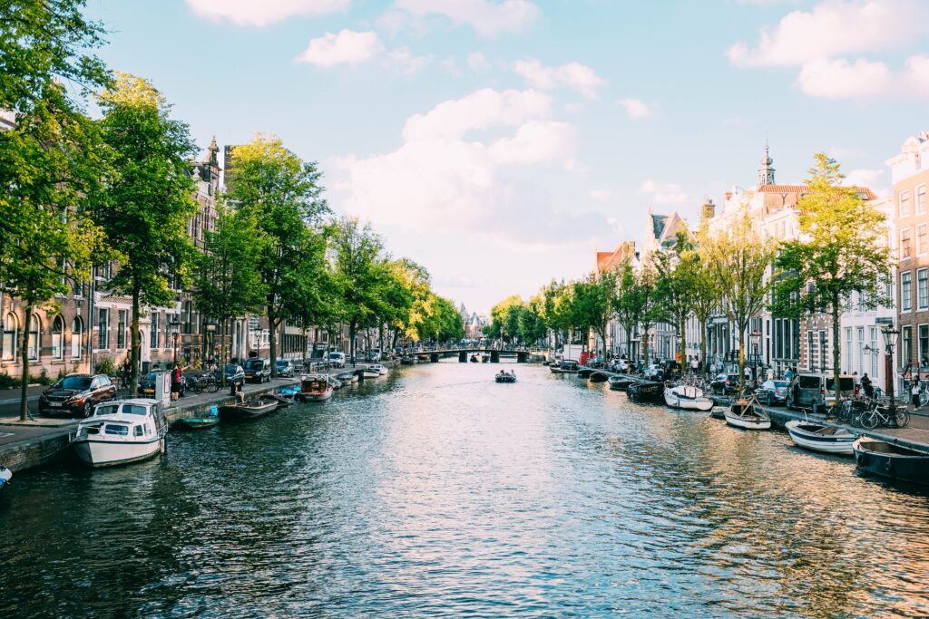 a canal with boats and buildings on the side