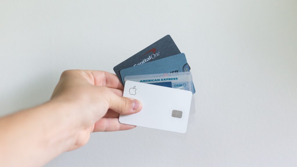 a hand holding a credit card