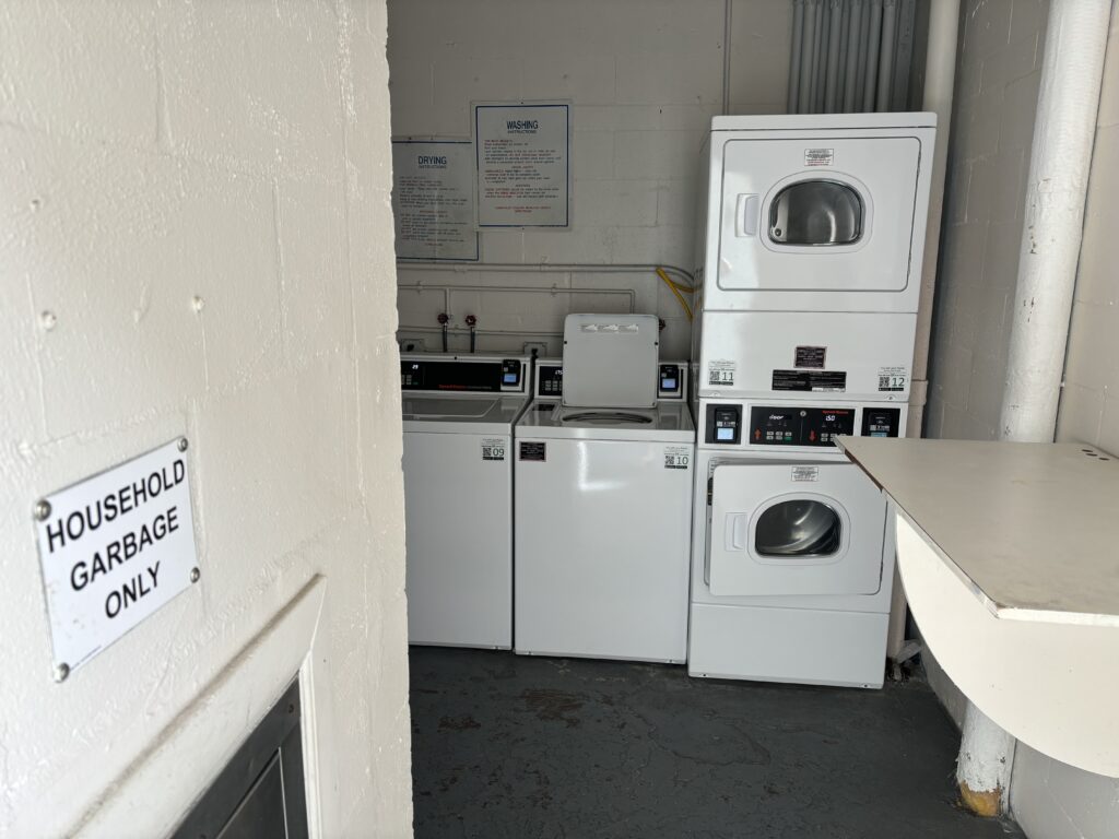 a laundry room with washers and dryers