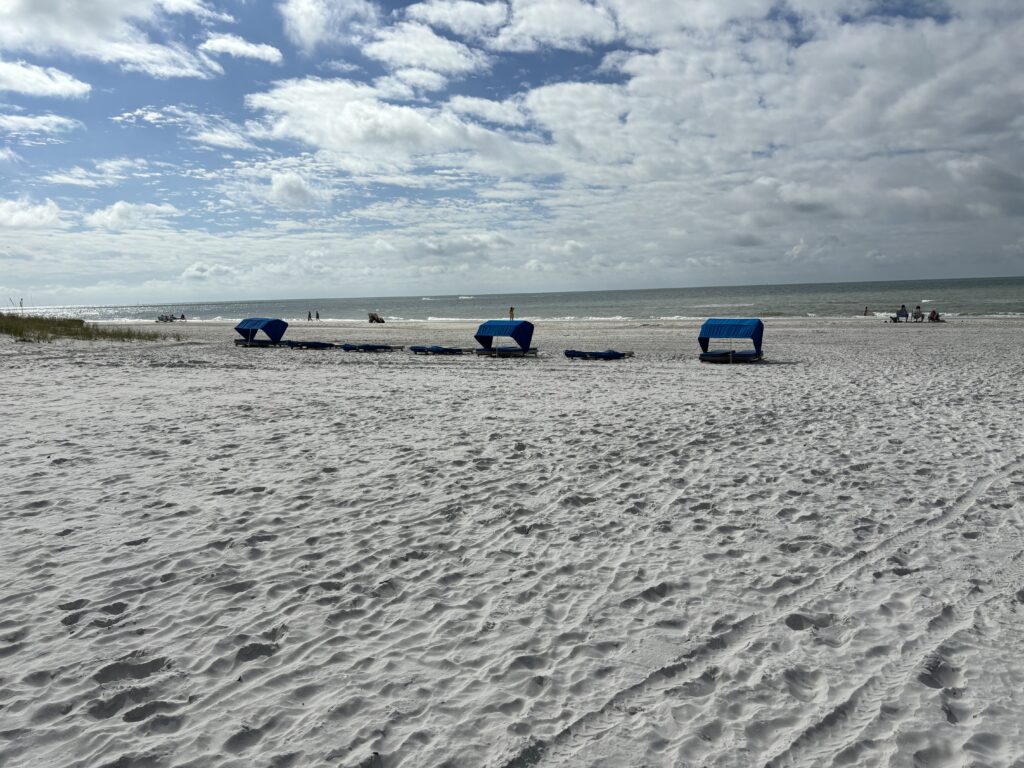 a group of tents on a beach