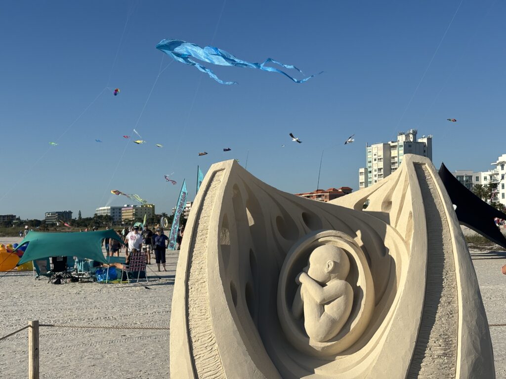 a sand sculpture on a beach
