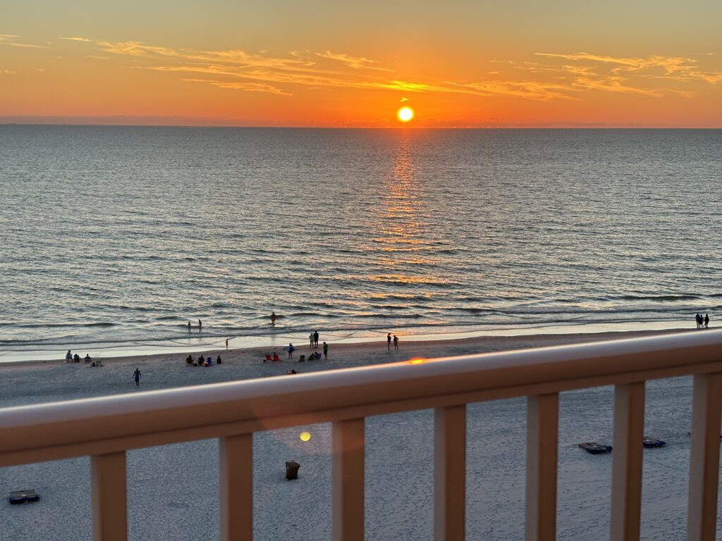 a sunset over a beach
