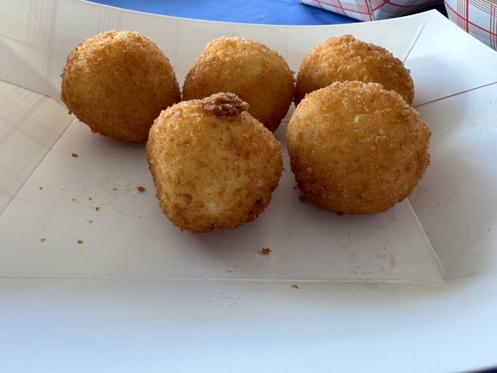 a group of fried balls on a white box