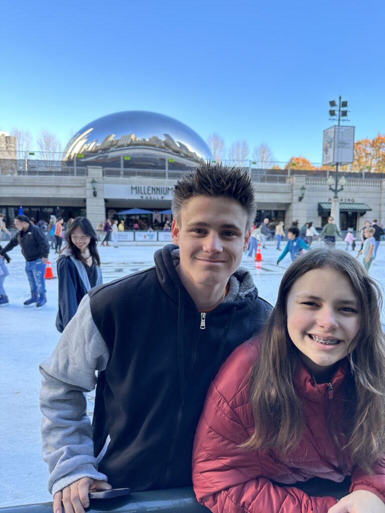 a boy and girl posing for a picture