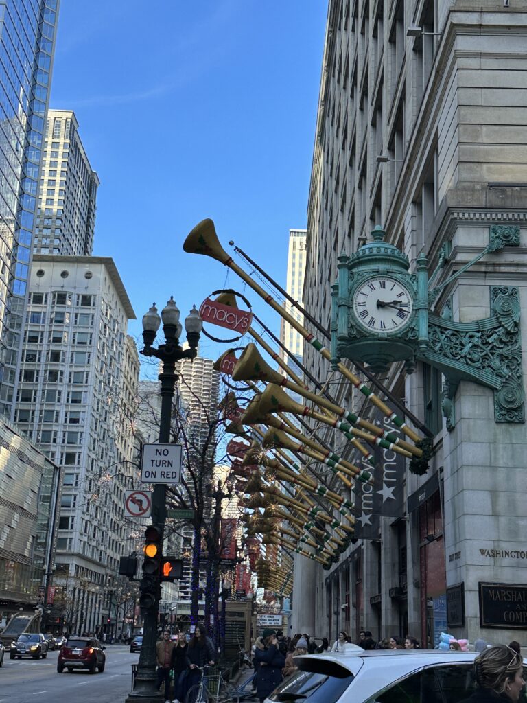 a street with a clock and musical instruments