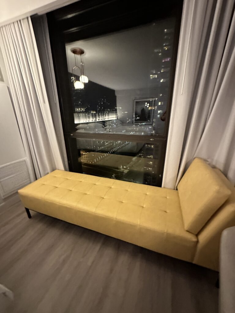 a couch next to a window