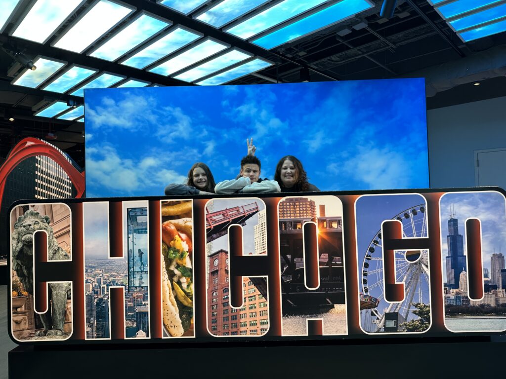 a group of people standing on a sign