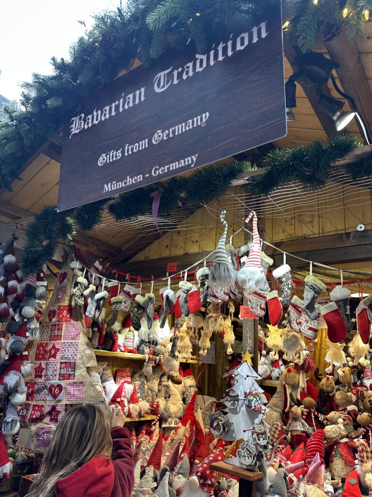 a sign with a group of stuffed toys