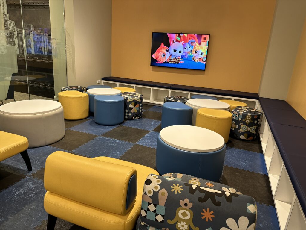 a room with a television and chairs