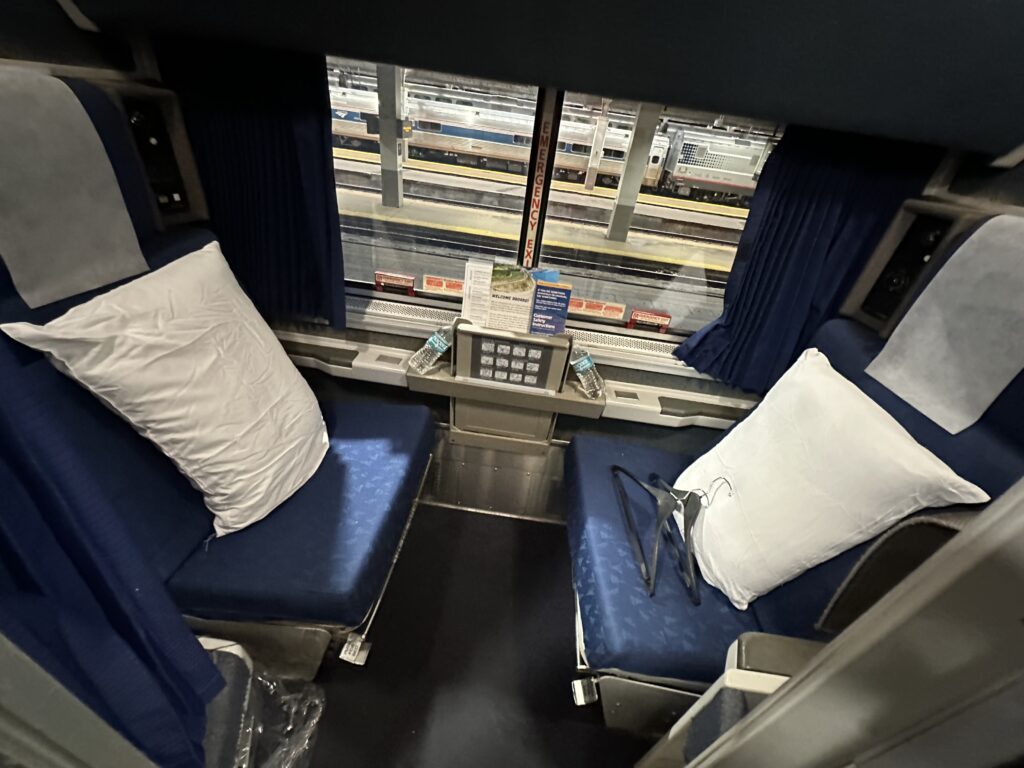 a train with blue seats and a window