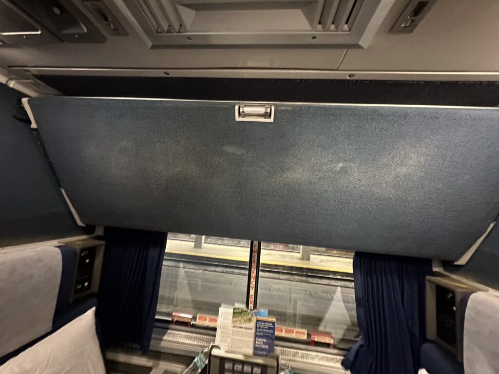 a window with a blue curtain