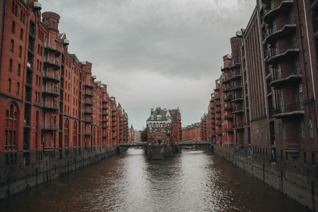 a canal between buildings with many balconies