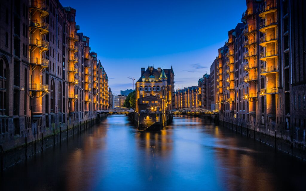 a river with buildings and lights