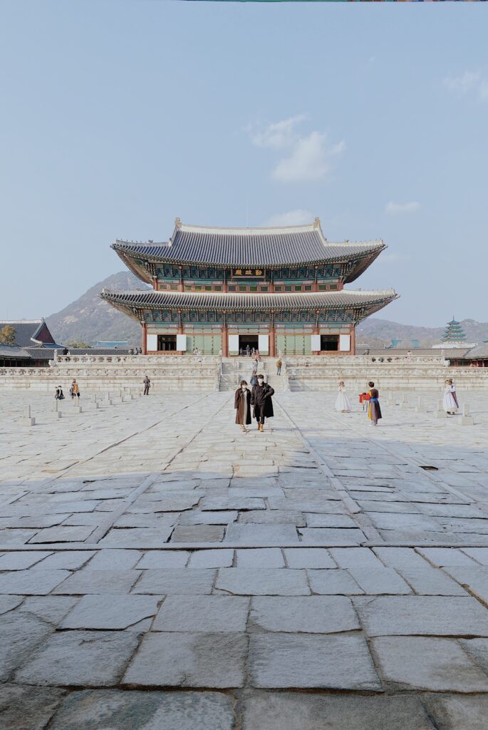 a group of people walking in a courtyard