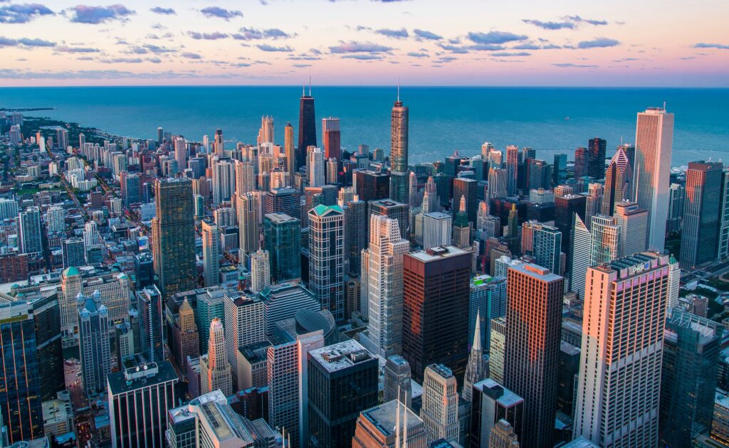 a city with many tall buildings and a body of water