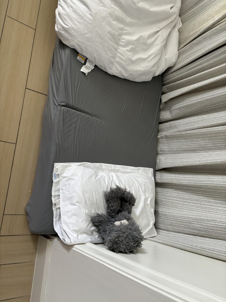 a stuffed animal on a bed