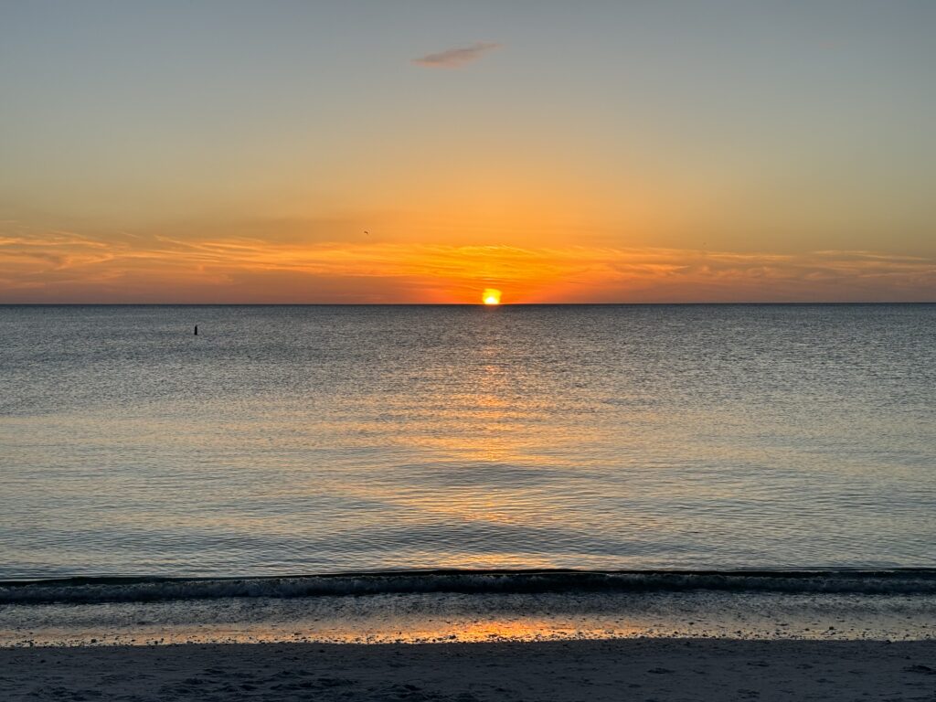 a sunset over a body of water