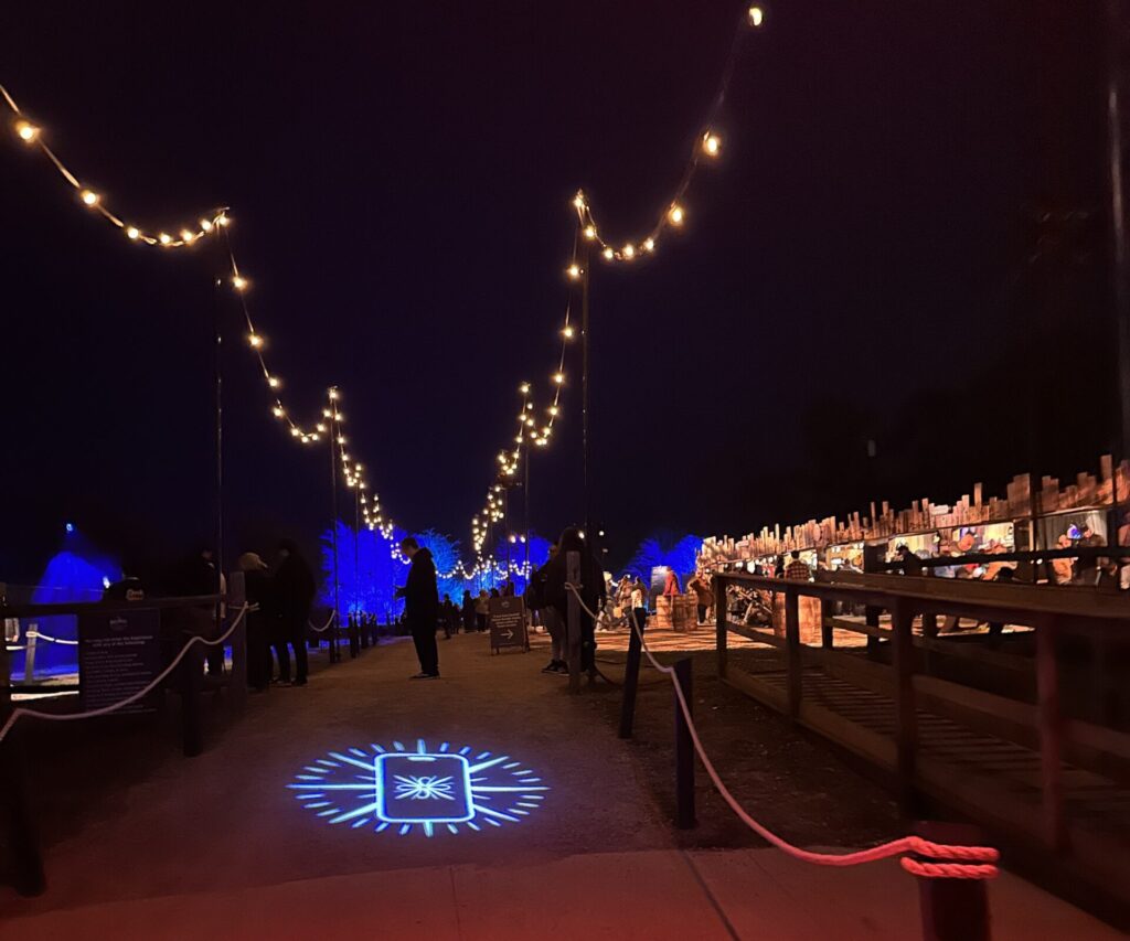 a walkway with lights on it