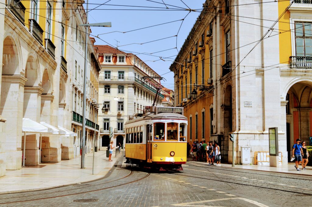 a yellow trolley on a street