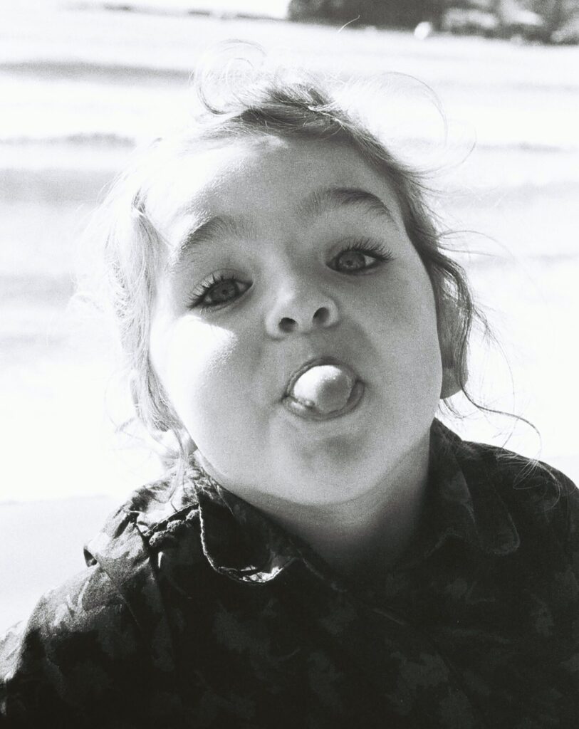 a child sticking her tongue out
