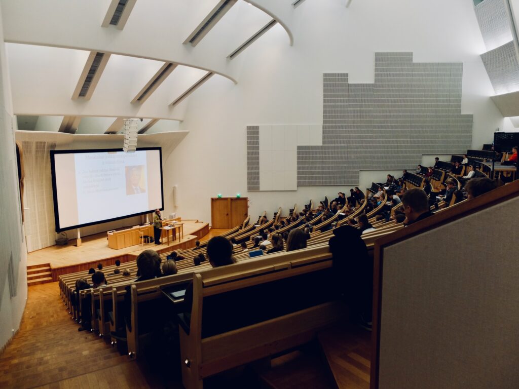 a group of people in a lecture hall