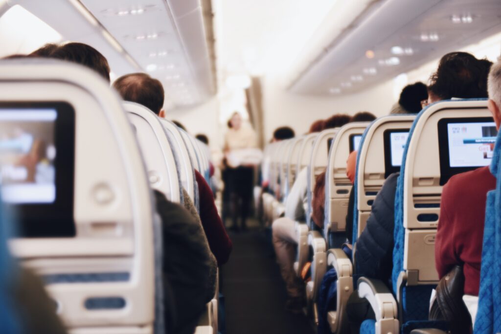 a group of people sitting in an airplane